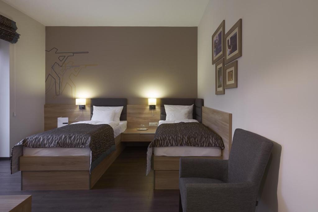 Postel nebo postele na pokoji v ubytování Hotel Therapia