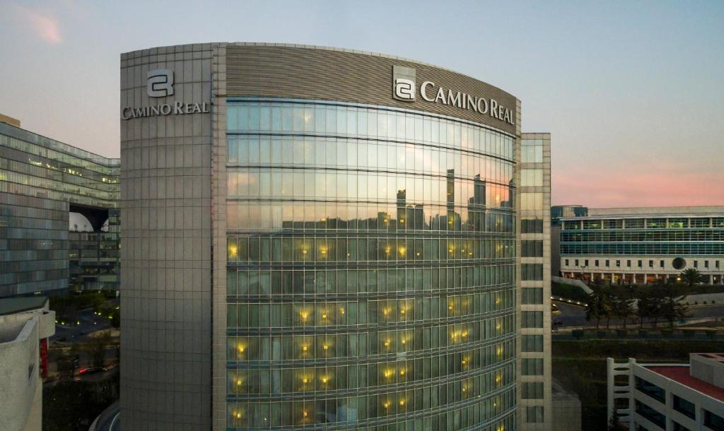 a building with a sign on the side of it at Camino Real Santa Fe in Mexico City