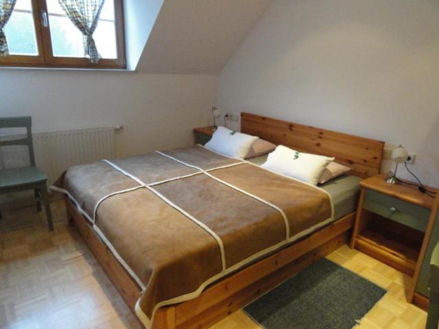 Postel nebo postele na pokoji v ubytování Farm Stay Dolinar Krainer