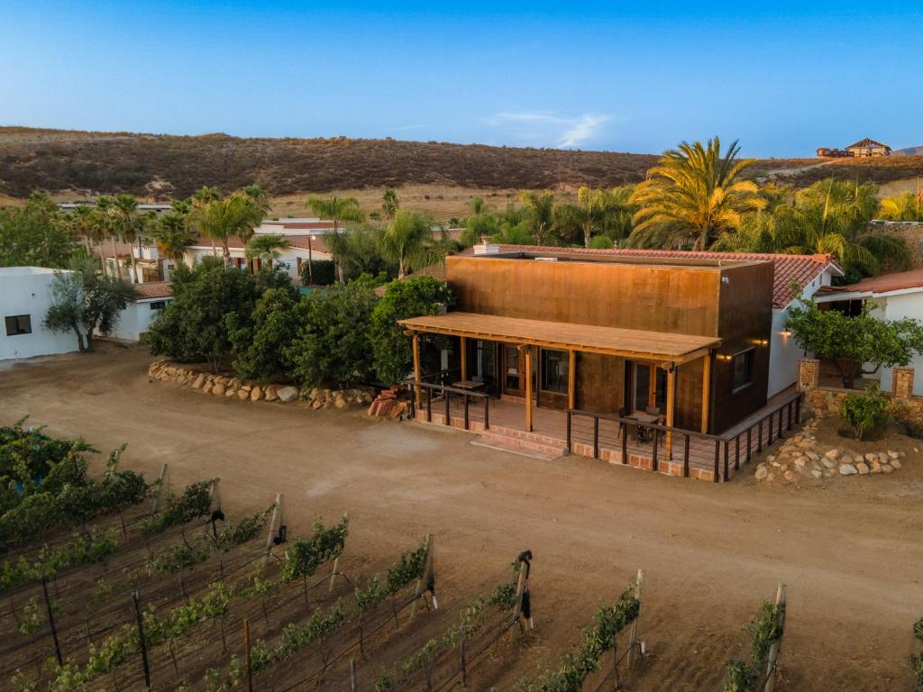 an aerial view of a house in a vineyard at Surya Hotel in Valle de Guadalupe
