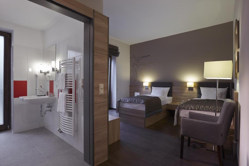 Ένα ή περισσότερα κρεβάτια σε δωμάτιο στο Hotel Therapia