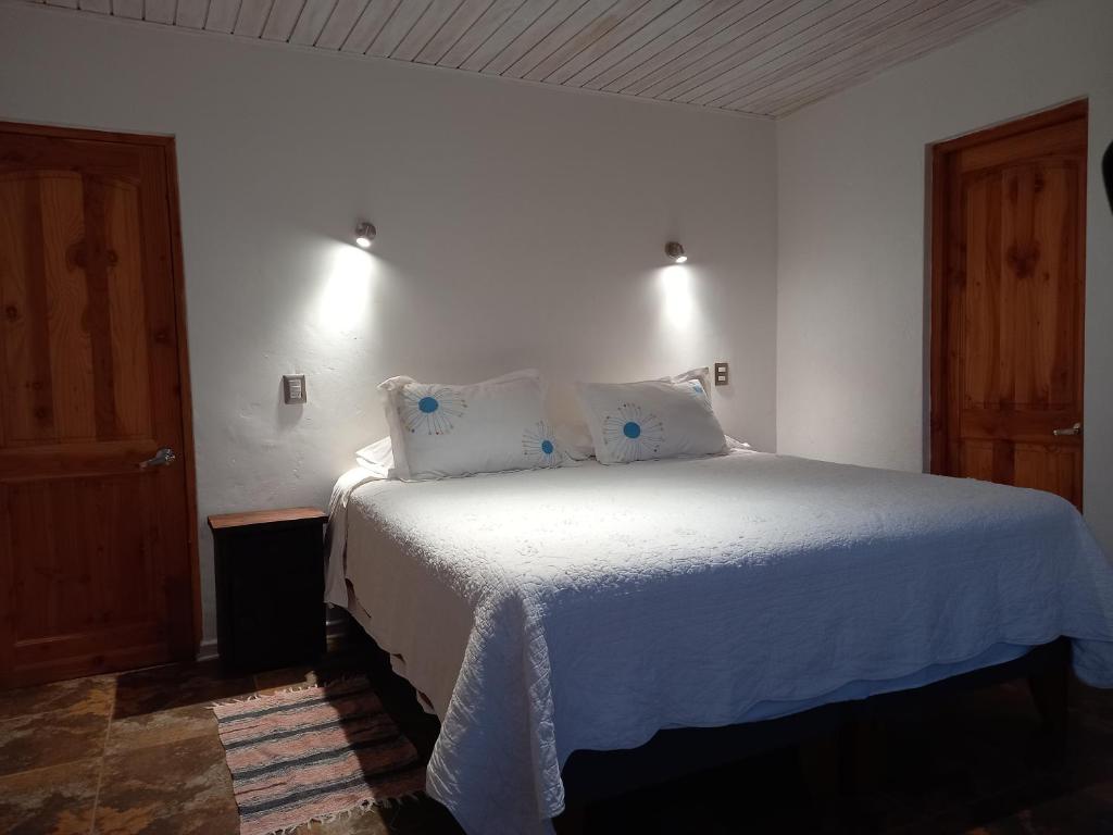 Postel nebo postele na pokoji v ubytování Cabañas Urmeneta Sur