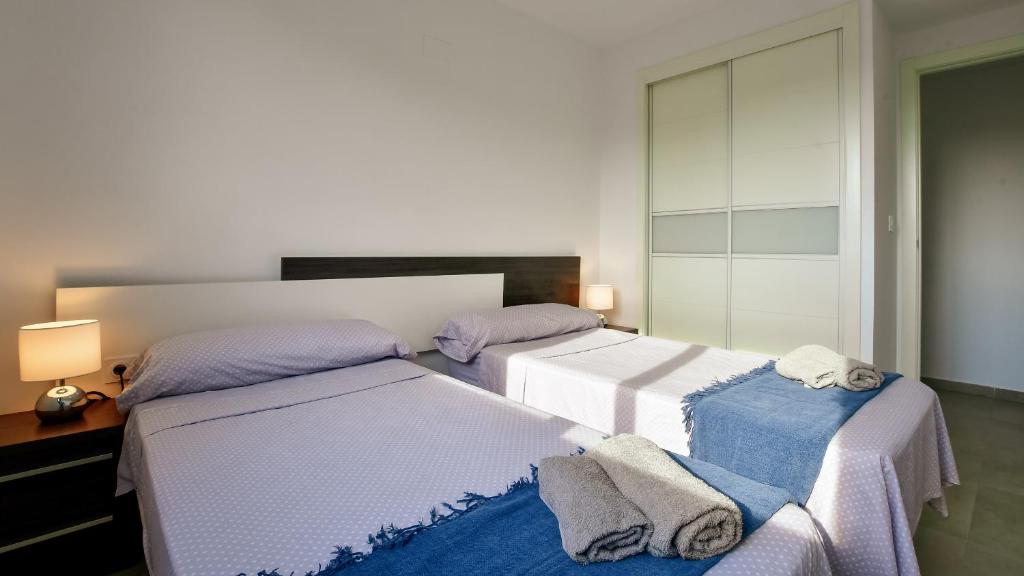 Posteľ alebo postele v izbe v ubytovaní Apartamento Sea Senses