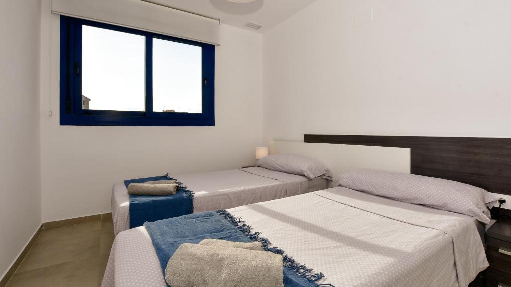 Posteľ alebo postele v izbe v ubytovaní Apartamento Sea Senses