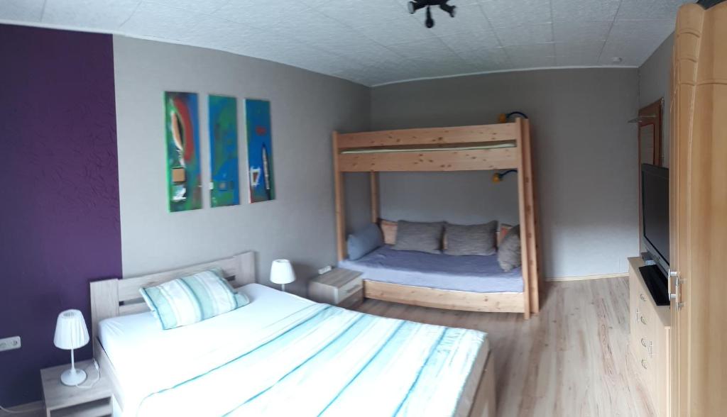 Postel nebo postele na pokoji v ubytování Gästehaus Möbius