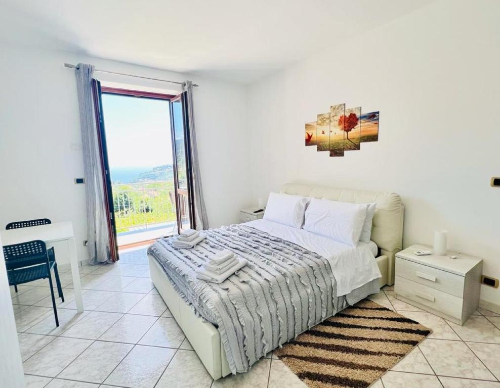 A bed or beds in a room at La Villa Carmelina