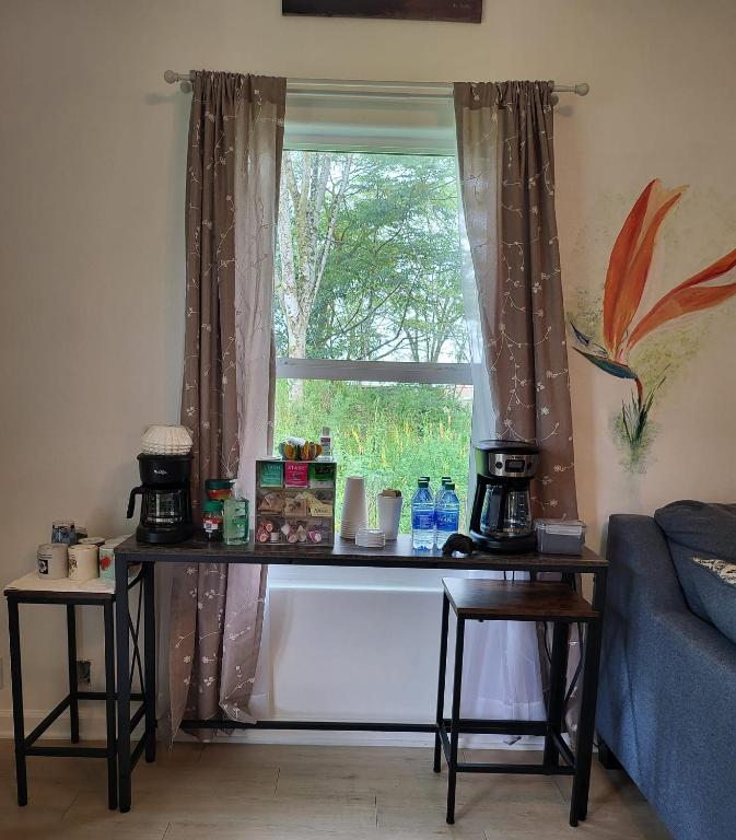 a table in front of a window in a room at Hoomaikai Blessings in Keaau