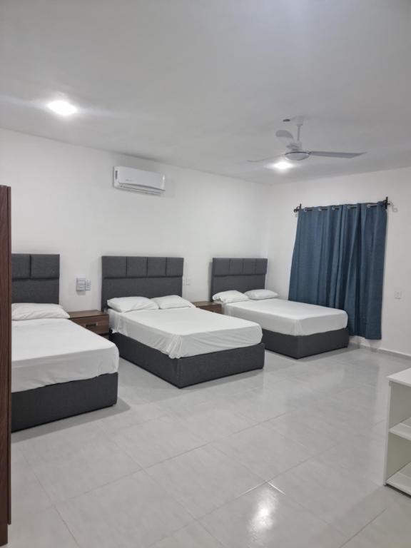 Ένα ή περισσότερα κρεβάτια σε δωμάτιο στο Casa Neptuno Tulum