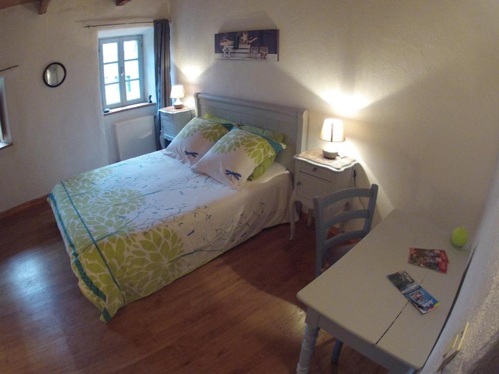 Postel nebo postele na pokoji v ubytování Salomony Chambre d'Hôtes