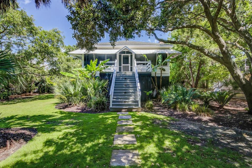 a house with stairs leading up to it at Sullivan's Island Serenity in Sullivans Island