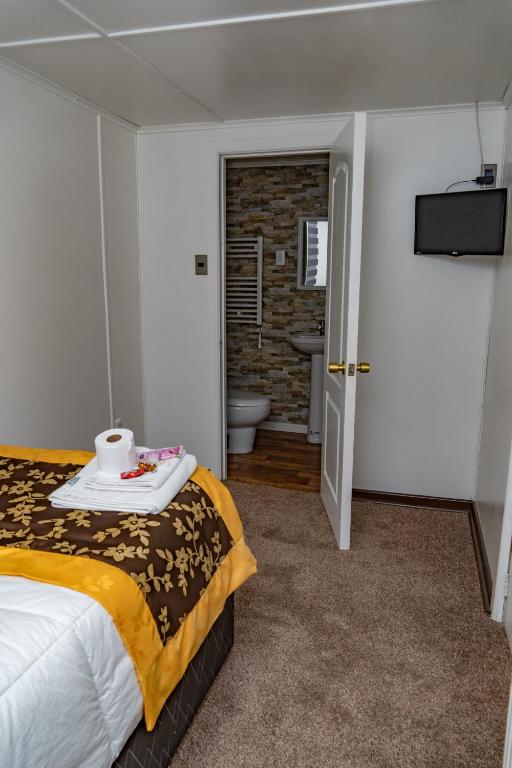 Postel nebo postele na pokoji v ubytování Hotel Forjadores del Cabo de Hornos