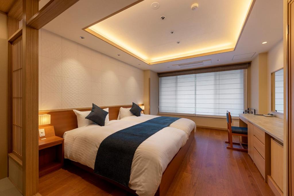 Postel nebo postele na pokoji v ubytování Shikanoyu Hotel