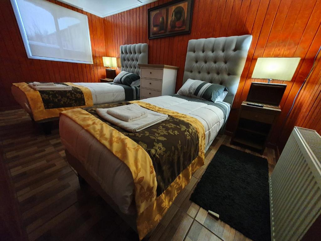 Postel nebo postele na pokoji v ubytování Hotel Forjadores del Cabo de Hornos