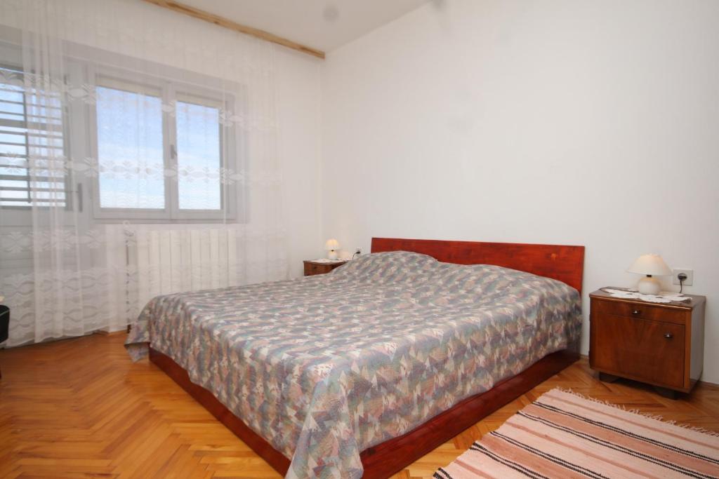 Postel nebo postele na pokoji v ubytování Apartment Zavala 8802b