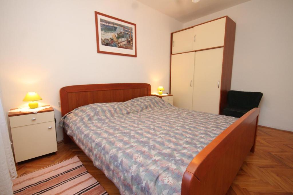 Postel nebo postele na pokoji v ubytování Apartment Zavala 8802b