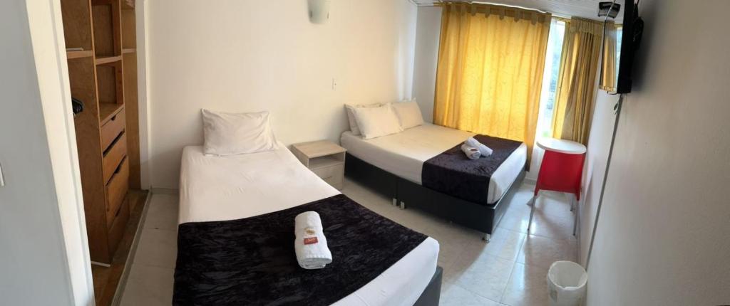 Postel nebo postele na pokoji v ubytování HOTEL EMBASSY STAR
