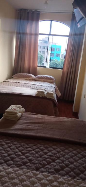 Postel nebo postele na pokoji v ubytování Hospedaje turístico Peruvian Wasi
