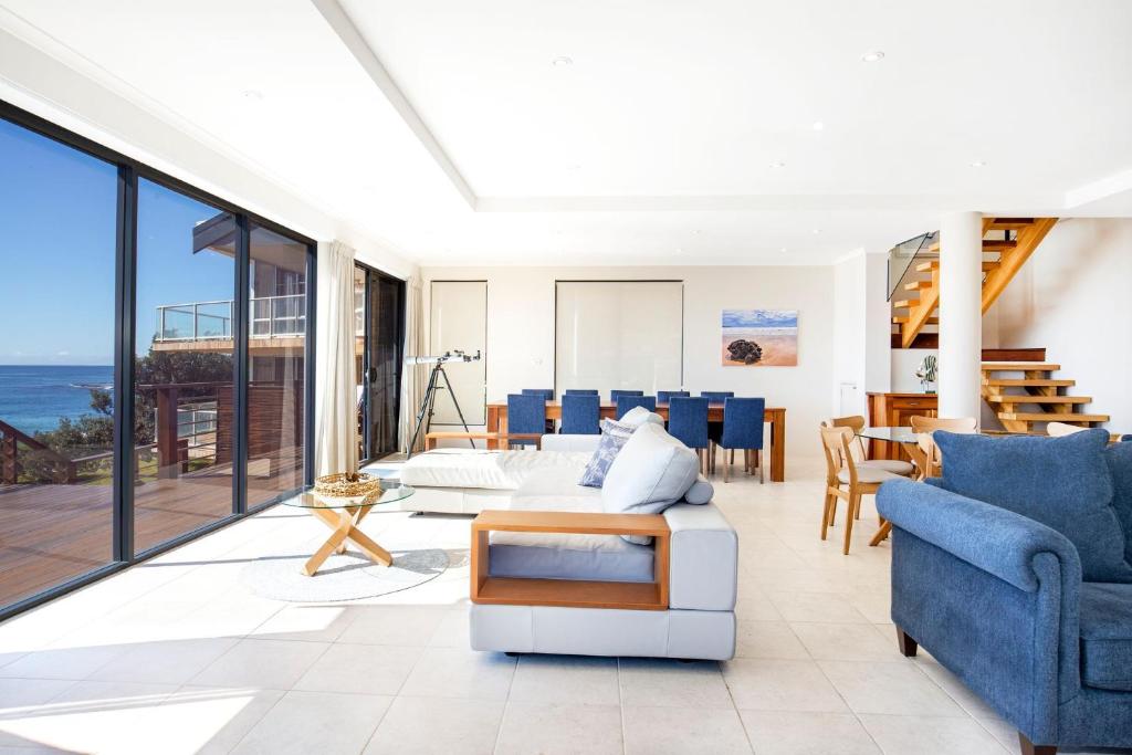 a living room with views of the ocean at Eclipse Absolute Beachfront with Stunning Views in Culburra Beach