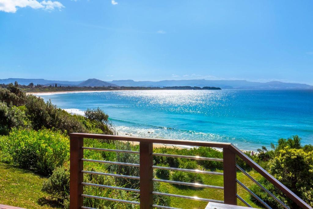 a view of the ocean from a balcony at Eclipse Absolute Beachfront with Stunning Views in Culburra Beach