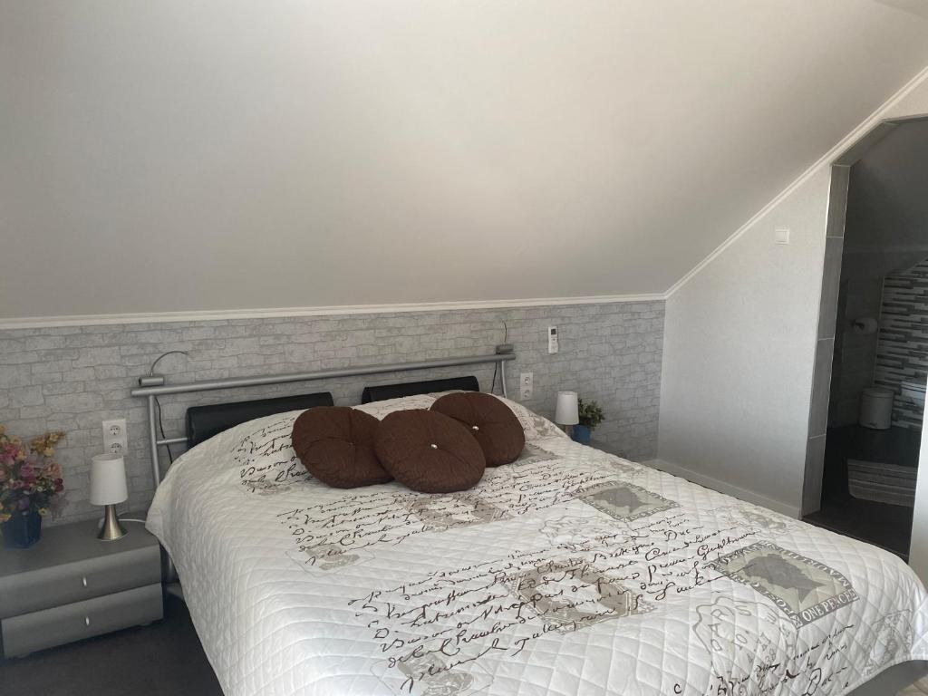 Postel nebo postele na pokoji v ubytování Maria Vendéghaz