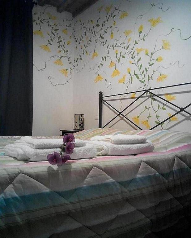 A bed or beds in a room at Certine Agriturismo