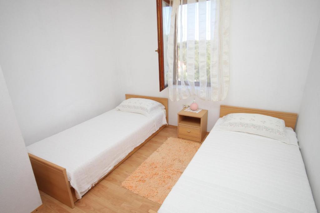 Posteľ alebo postele v izbe v ubytovaní Apartments with a parking space Sali, Dugi otok - 8152