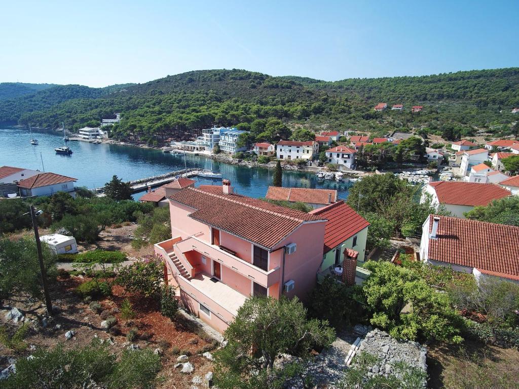 a view of a town and a river with a house at Apartments with a parking space Bozava, Dugi otok - 8124 in Božava