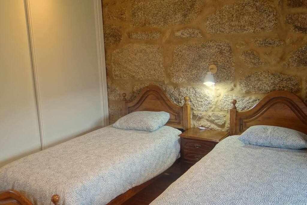 Postel nebo postele na pokoji v ubytování Cuberto Darriba Casa restaurada en Canedo