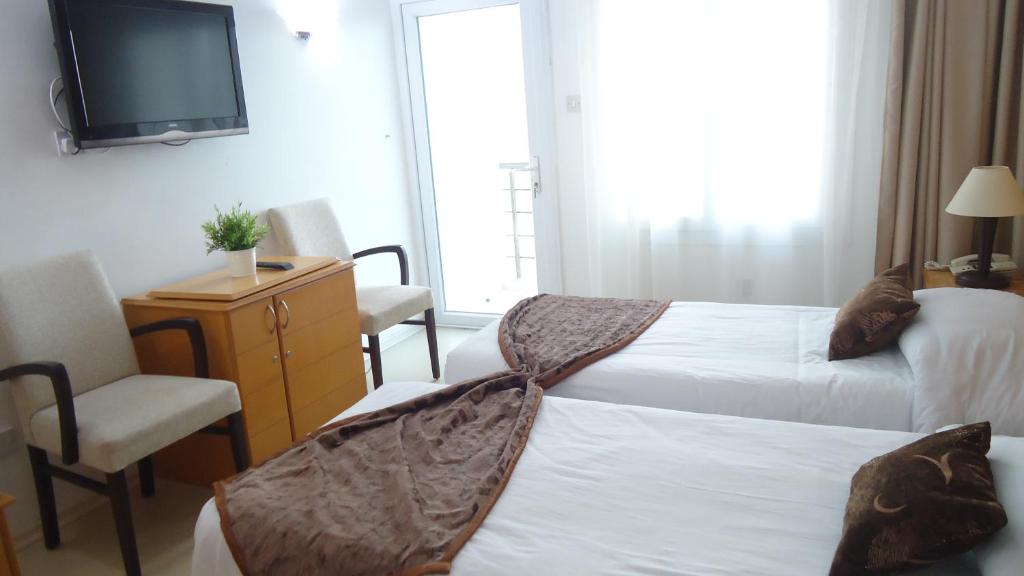 Postel nebo postele na pokoji v ubytování Ada Beach Hotel