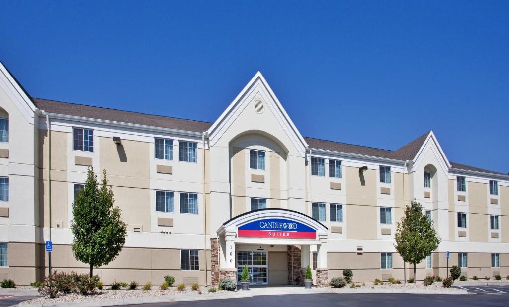 an exterior view of a hotel with a building at Candlewood Suites Junction City - Ft. Riley, an IHG Hotel in Junction City