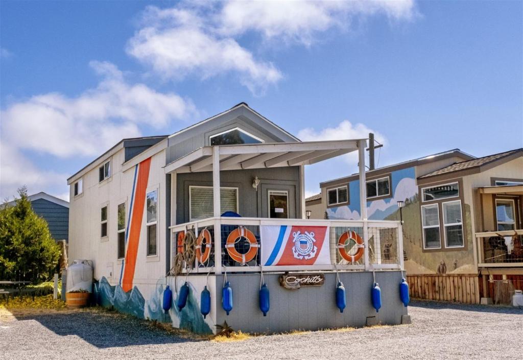 a house with a mural on the side of it at H - Cochito in Fort Bragg