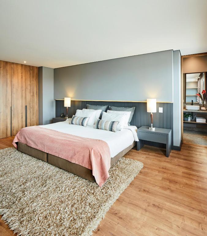 Postel nebo postele na pokoji v ubytování Nico Apartasuites
