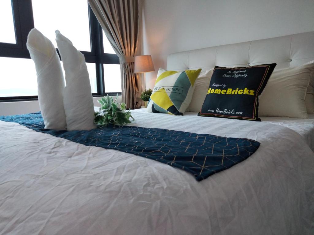 Ένα ή περισσότερα κρεβάτια σε δωμάτιο στο Link 2 Residence Bukit Jalil I HomeBrickz