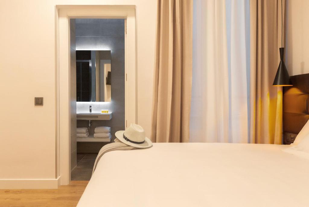 Postel nebo postele na pokoji v ubytování Woohoo Rooms Fuencarral