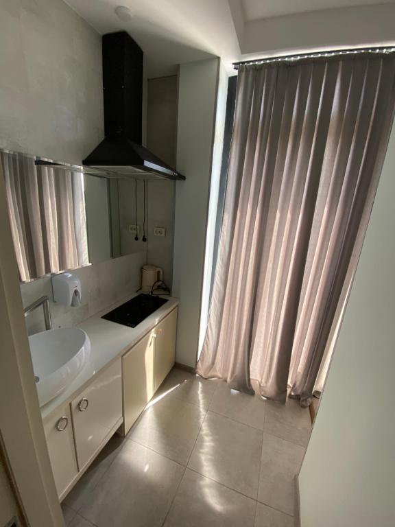 Postel nebo postele na pokoji v ubytování Hotel Rustaveli