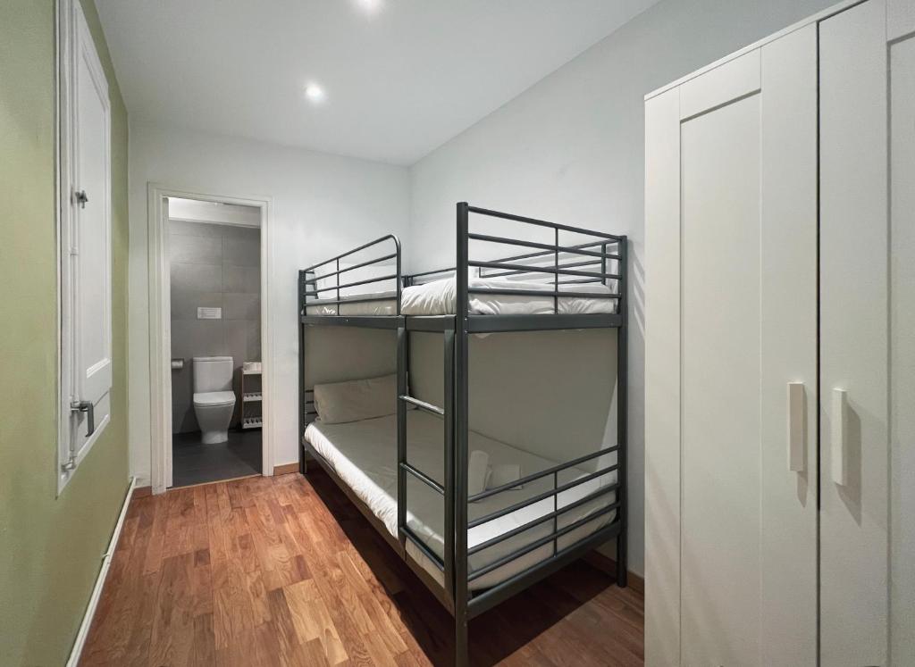 Postel nebo postele na pokoji v ubytování Stay U-nique Apartments Aribau II