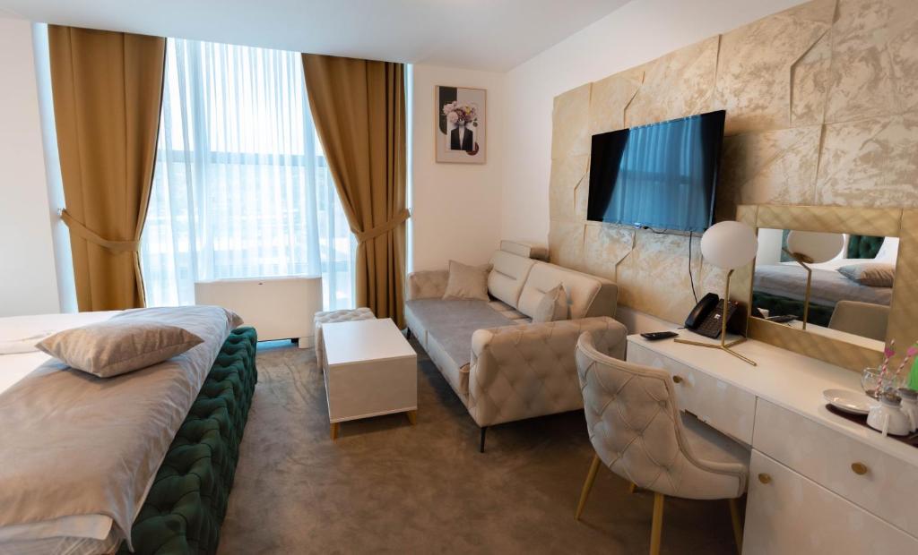 Postel nebo postele na pokoji v ubytování Hotel IDEAL Deluxe