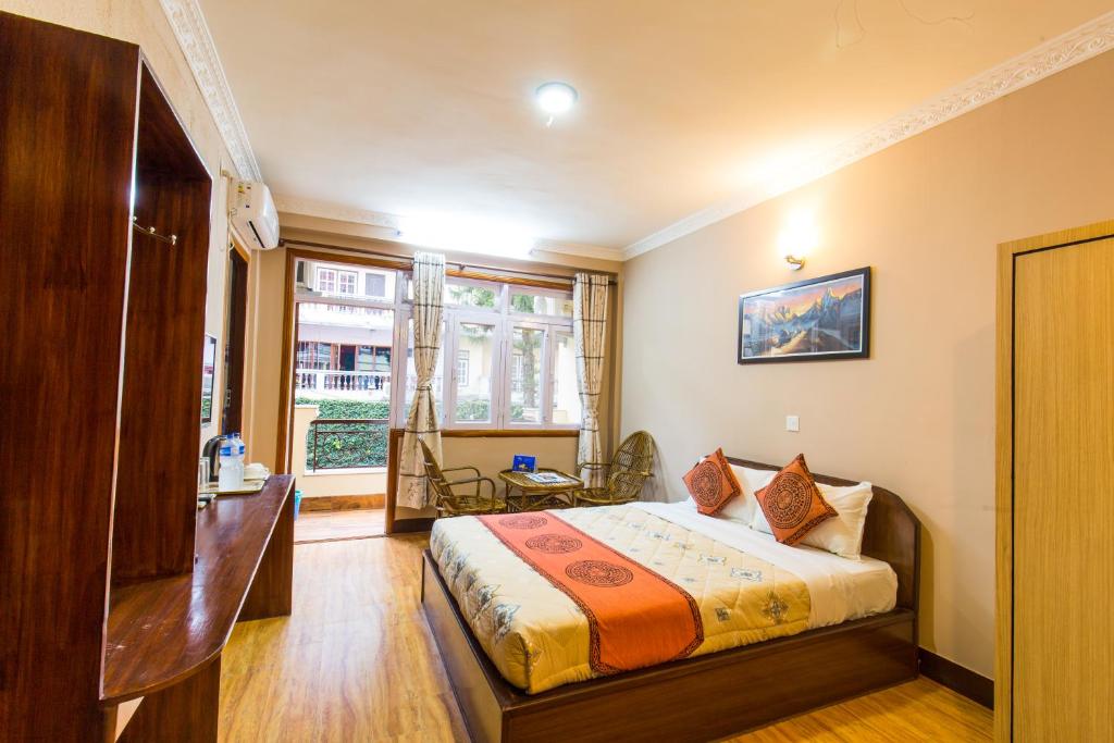 Postel nebo postele na pokoji v ubytování Hotel Acme Inn