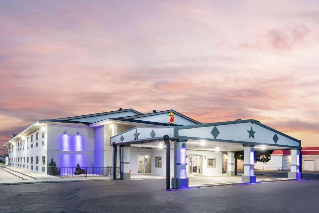 a rendering of the front of a building at Super 8 by Wyndham Amarillo Central TX in Amarillo