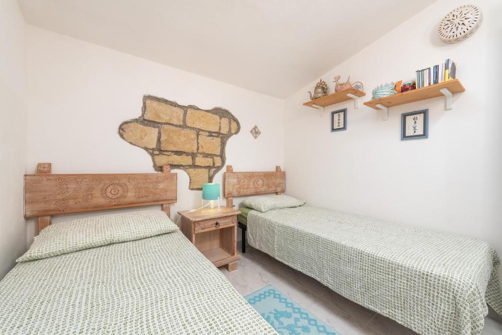 Postel nebo postele na pokoji v ubytování L'appartamento nel Corso