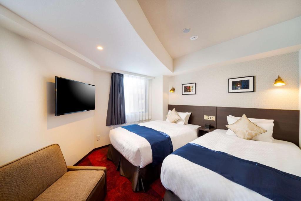 Postel nebo postele na pokoji v ubytování Best Western Hotel Fino Shin-Yokohama
