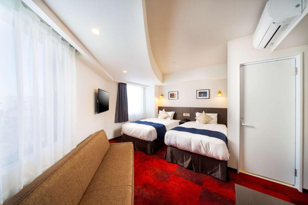 Postel nebo postele na pokoji v ubytování Best Western Hotel Fino Shin-Yokohama