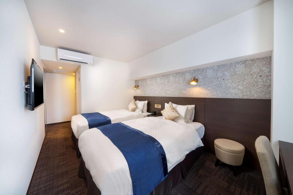 Postel nebo postele na pokoji v ubytování Best Western Hotel Fino Shin-Yokohama