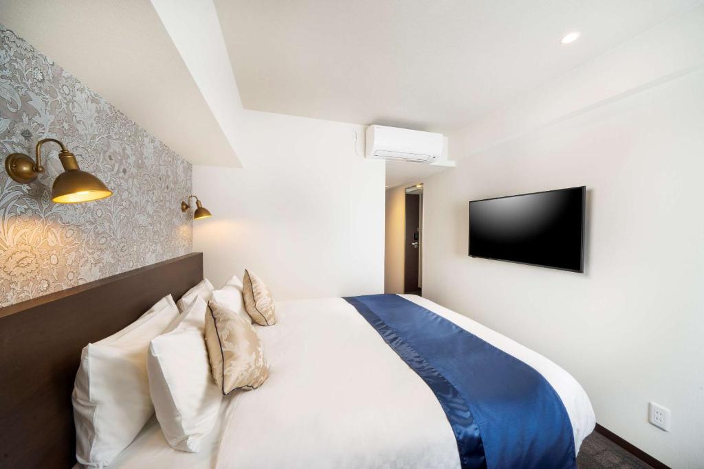 Postel nebo postele na pokoji v ubytování Best Western Hotel Fino Shin-Yokohama