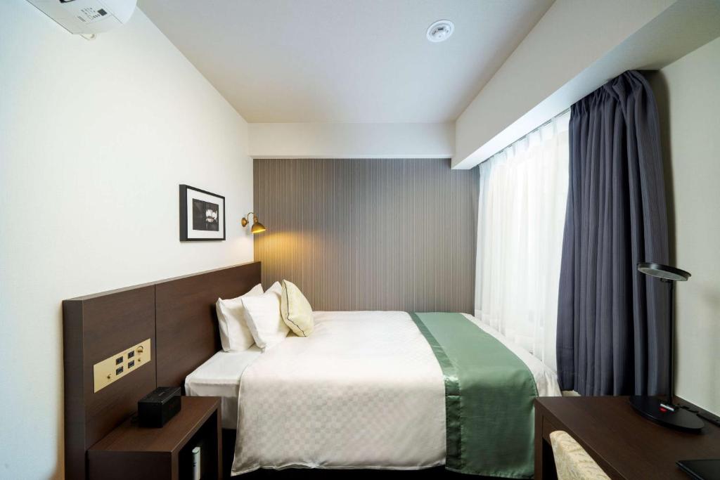 Postel nebo postele na pokoji v ubytování Best Western Hotel Fino Shin-Yokohama