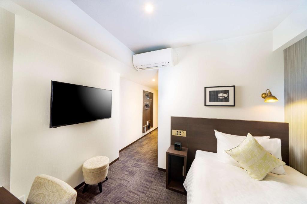 Postel nebo postele na pokoji v ubytování Best Western Hotel Fino Shin-Yokohama