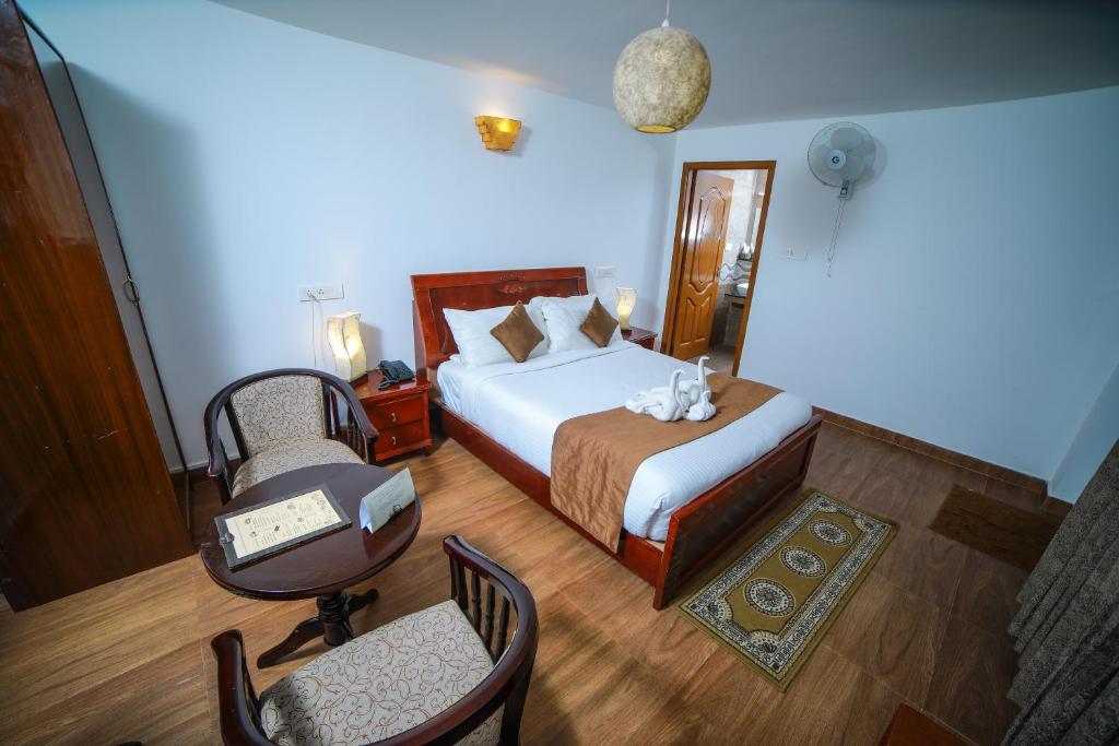 Postel nebo postele na pokoji v ubytování WOW Bison Woods Organic Veg Resort - Yercaud