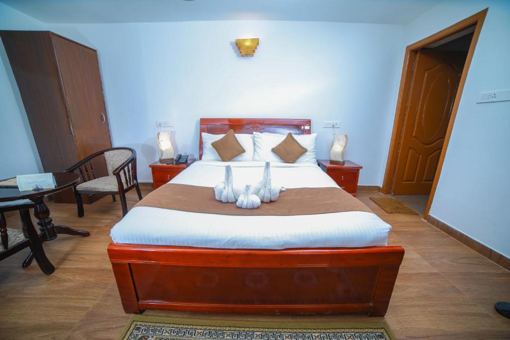 Postel nebo postele na pokoji v ubytování WOW Bison Woods Organic Veg Resort - Yercaud