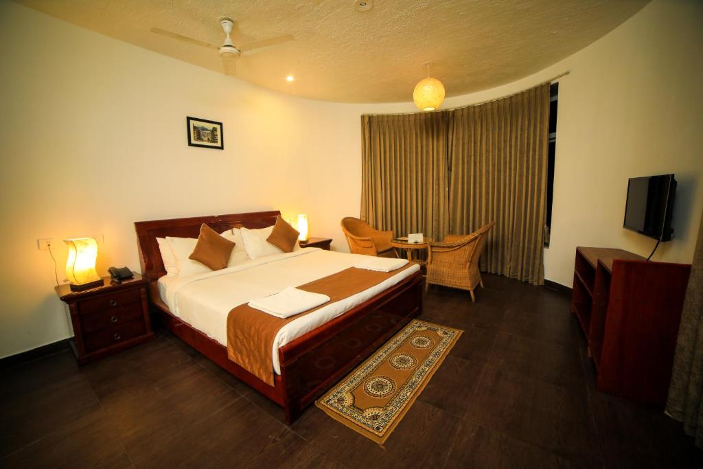 Postel nebo postele na pokoji v ubytování WOW Bison Woods Organic Veg Resort - Yercaud