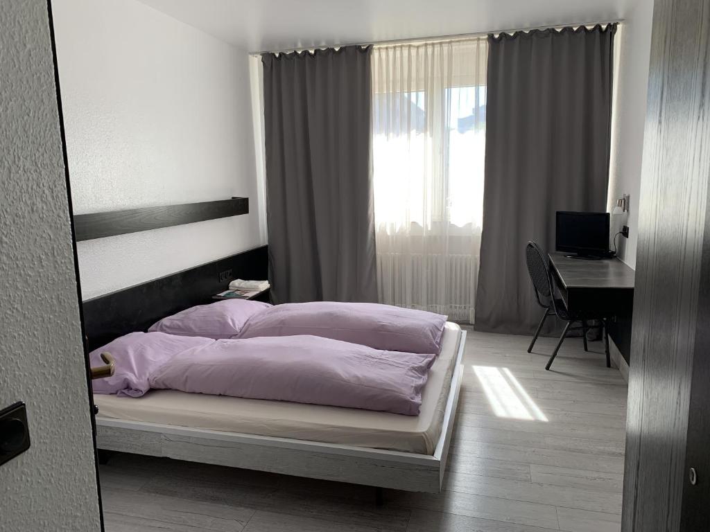 Posteľ alebo postele v izbe v ubytovaní City Hotel Dinslaken